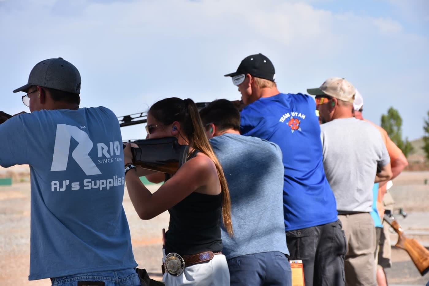 Members on the trap line with the Uintah ridges in the background.