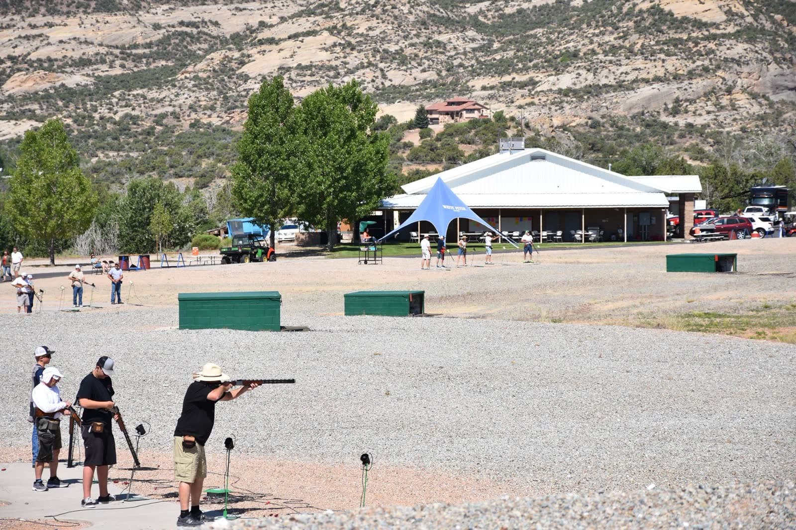 The Lodge with shooters in front and the Uintah ridges behind.